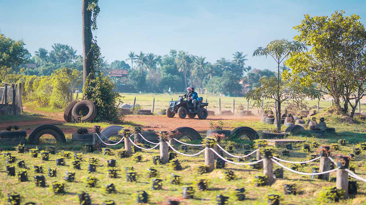 Quad bike riding in countryside fields